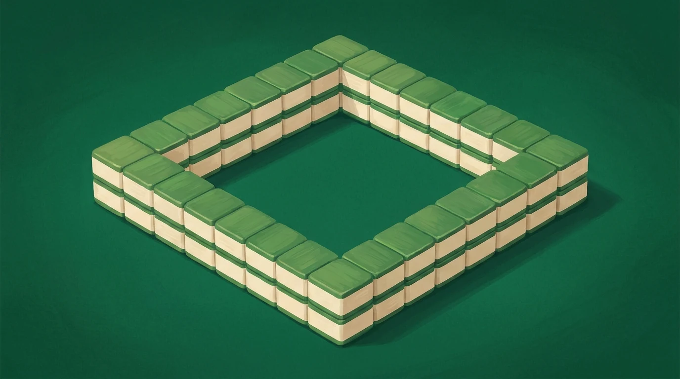 Illustration: a freshly built square wall of mahjong tiles on a green felt table.